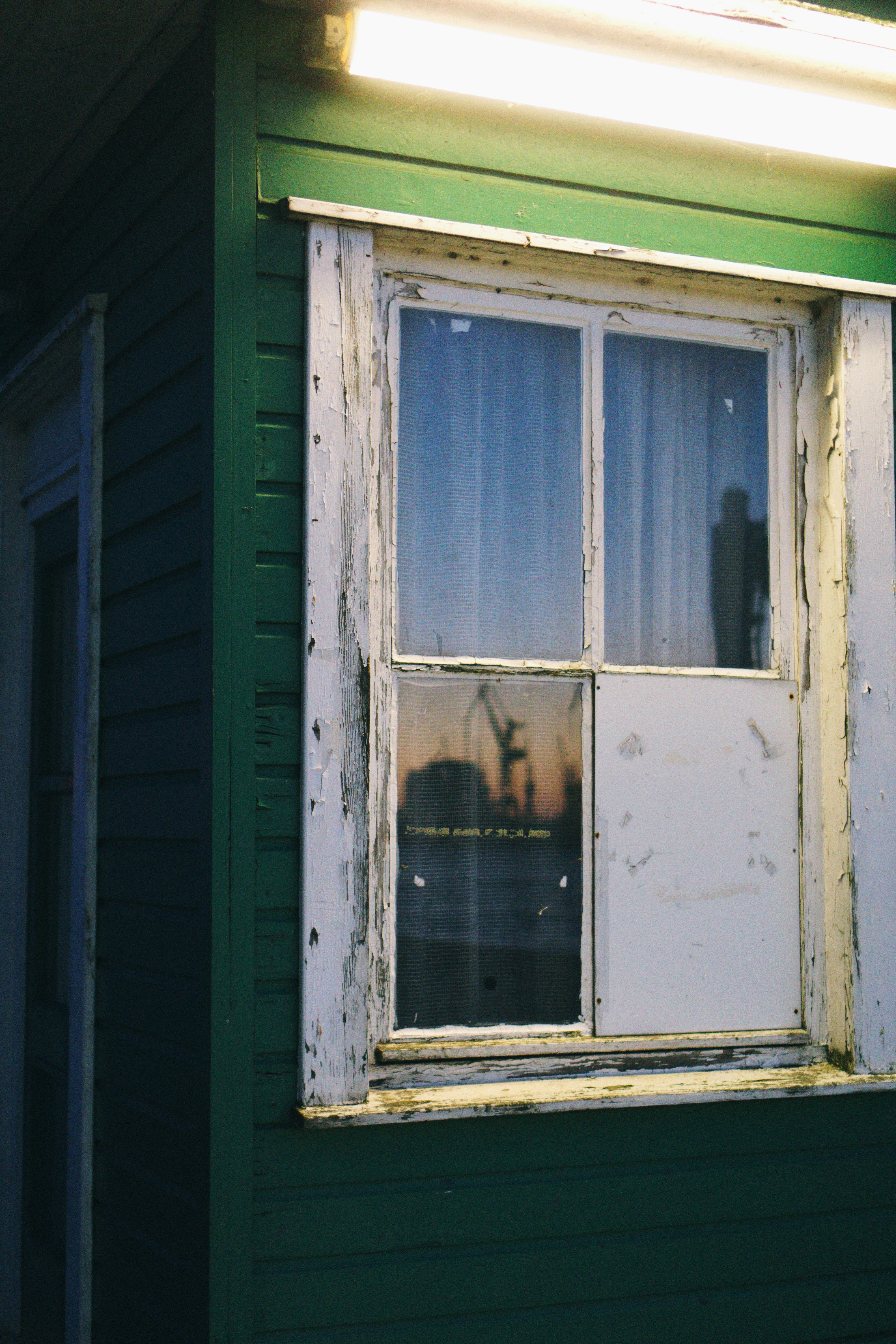 white wooden framed window pane